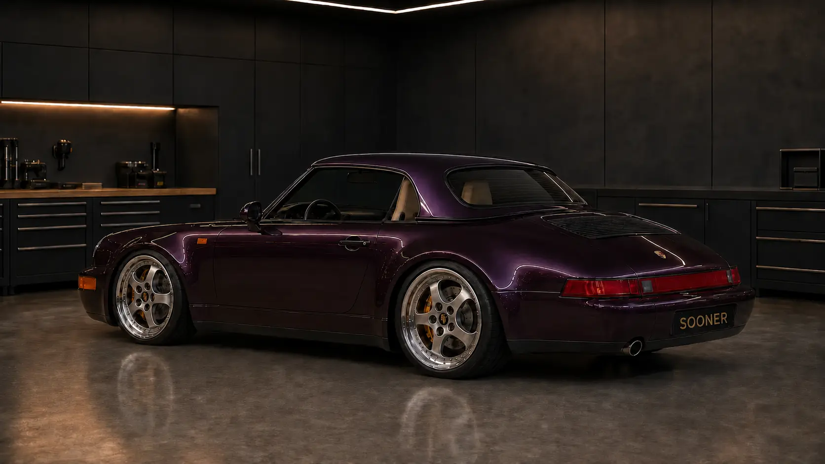 Rear three-quarter view of the aubergine Sooner Cabriolet with the roof cap installed and the separate engine lid unobstructed